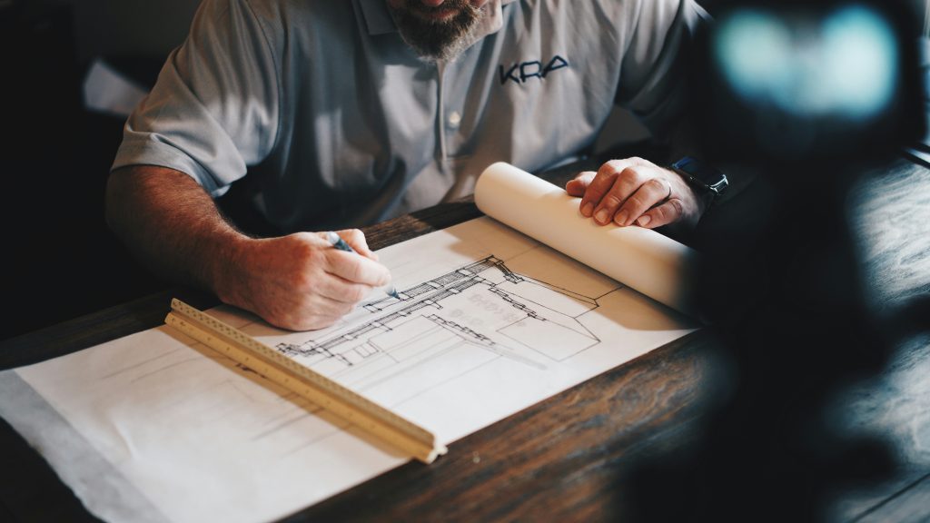 Home builder reviewing construction plans for a new home